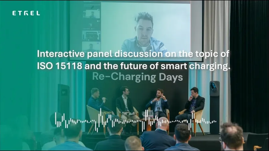 Four panellists seated on stage at Etrel's Re-Charging Days 2026 in Ljubljana, with a fifth joining remotely on the projection screen behind them.